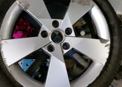Image of a badly damaged alloy wheel
